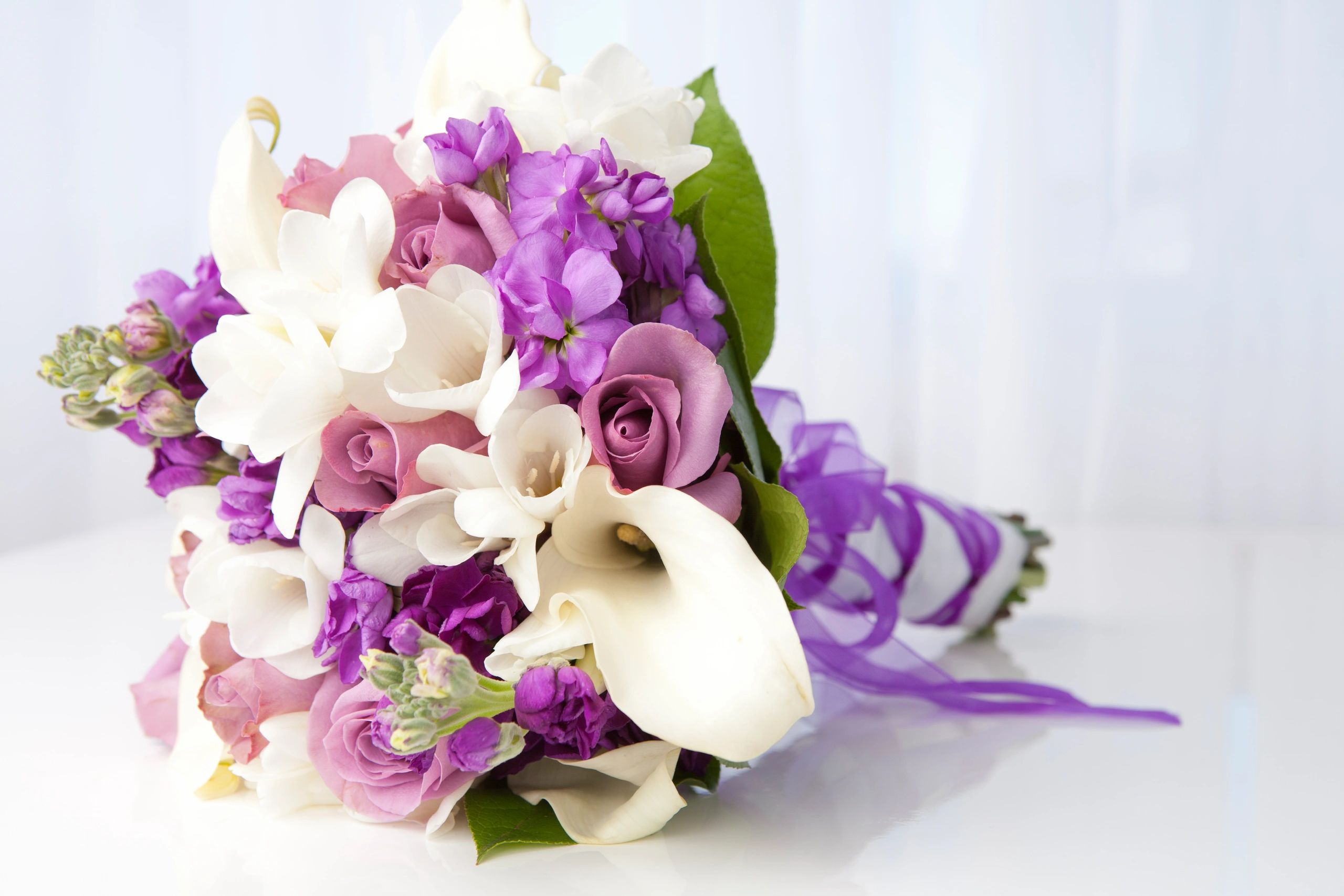 Purple and white seasonal flower bouquet